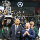 Dec 16, 2023; Atlanta, GA, USA; Florida A&M Rattlers head coach Willie Simmons holds up the Celebration Bowl trophy after a victory against the Howard Bison at Mercedes-Benz Stadium.